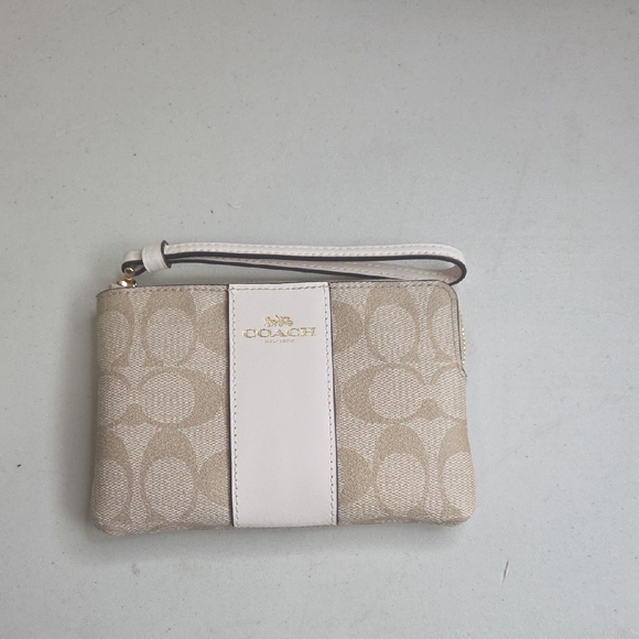 Coach Handbags - Coach Signature Beige and Cream Wristlet